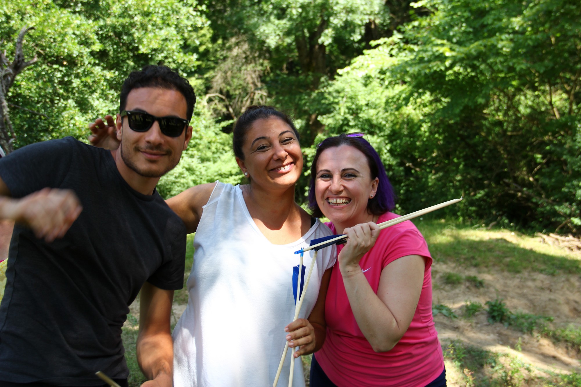 Three smiling participants celebrating together