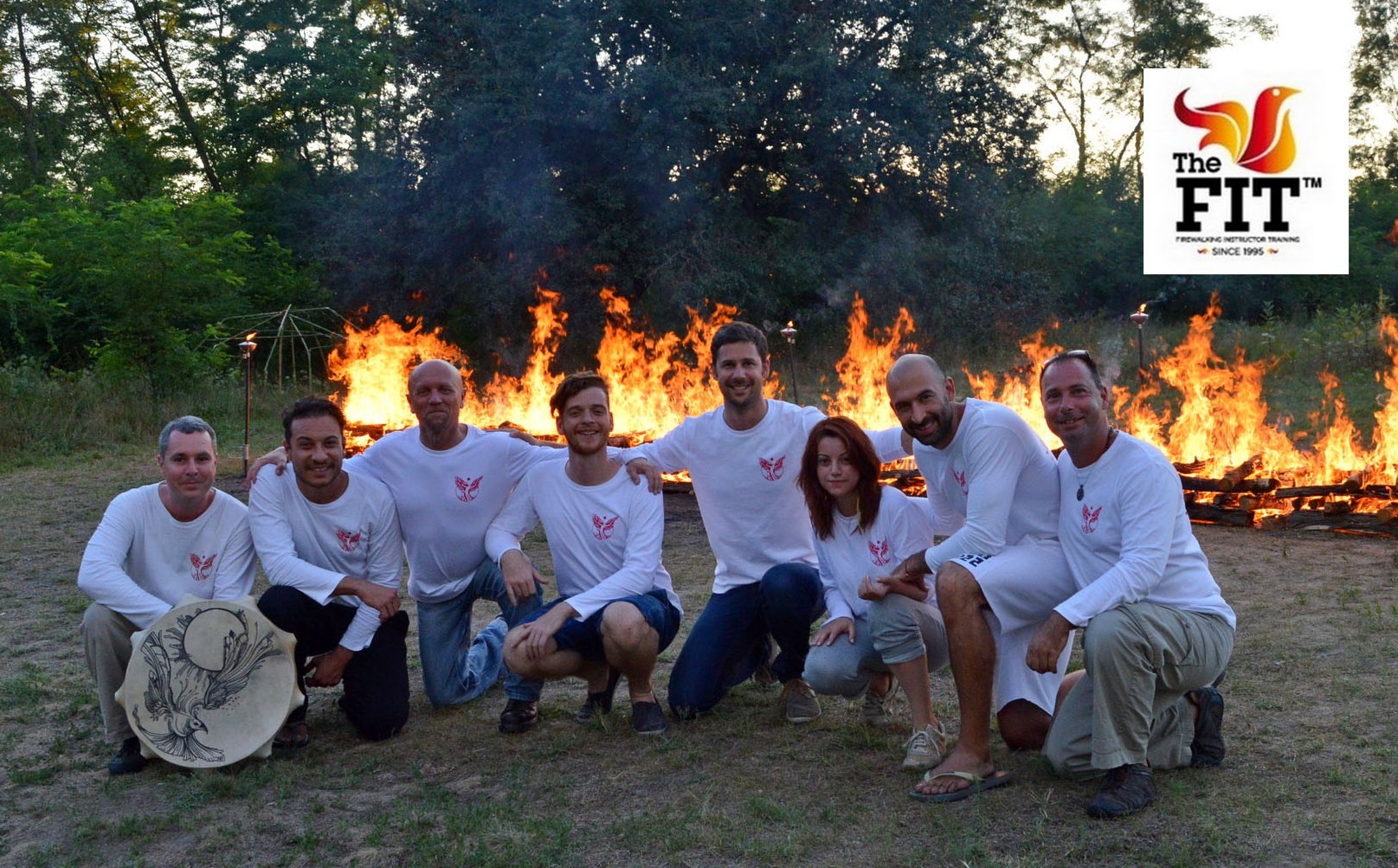 An international FIT group gathered in front of the fire