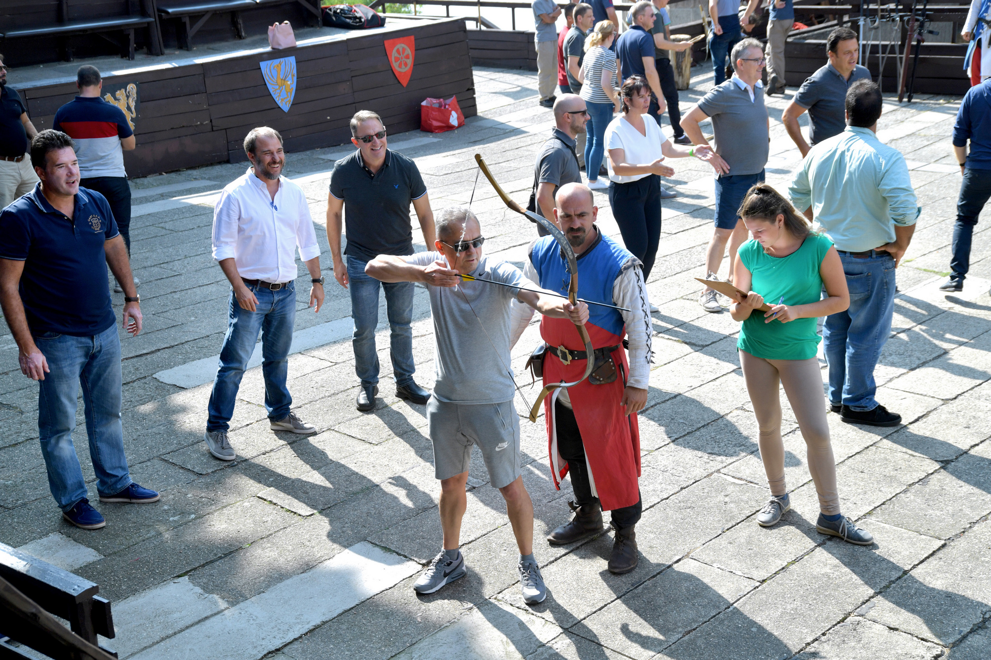 An international executive team member receiving guided support during an experiential challenge