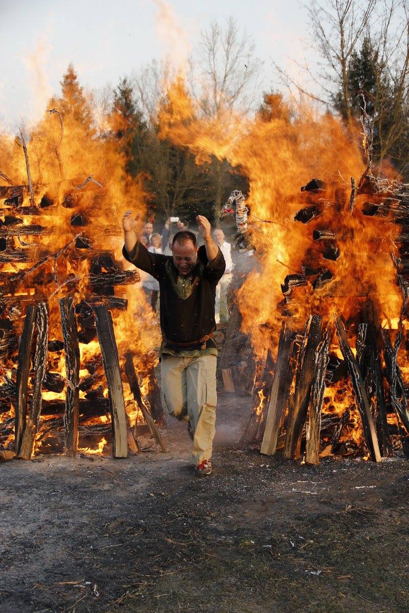 Bence László Tarr stepping between two towering pillars of fire