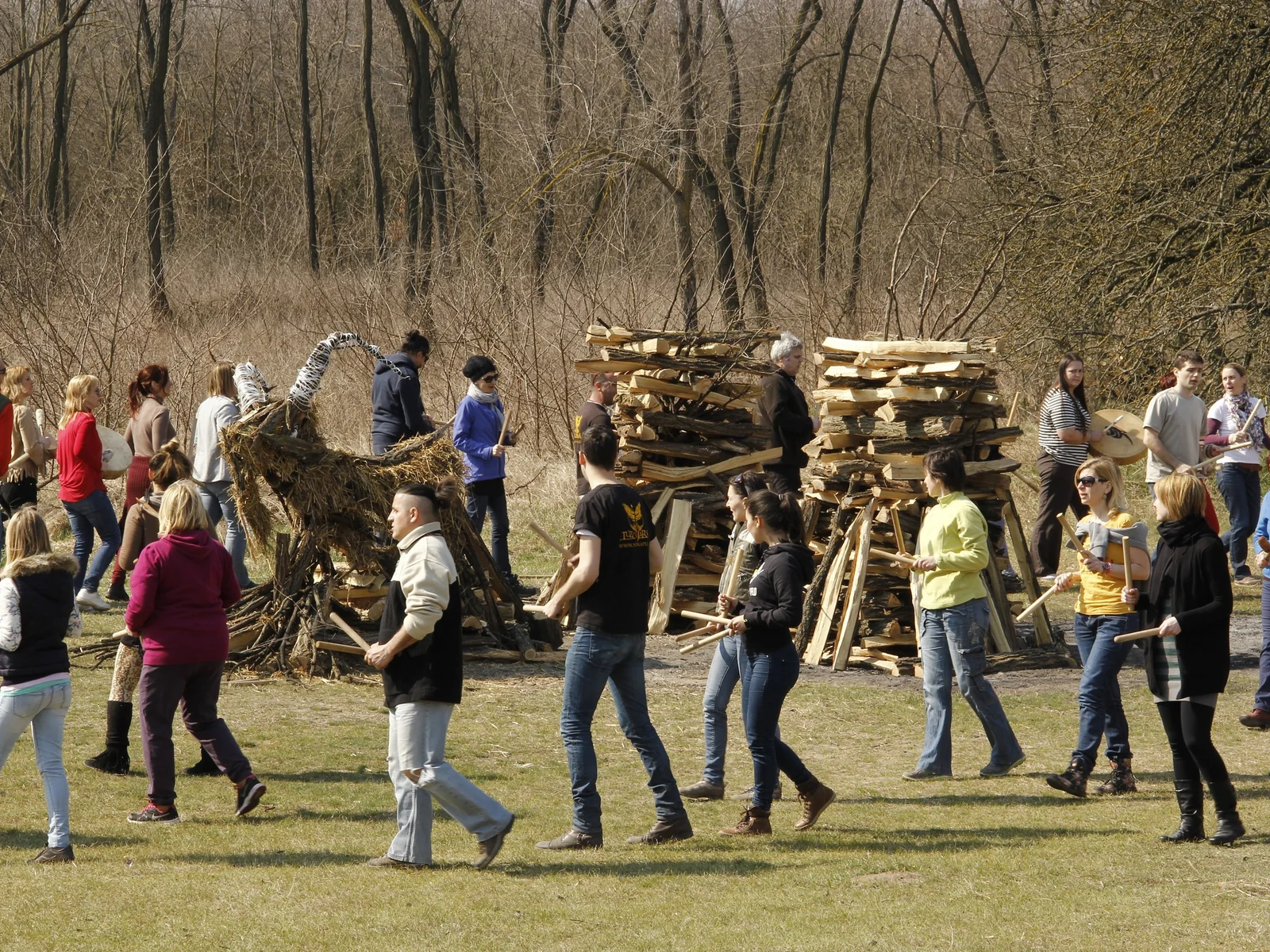 Participants moving together around carefully constructed ceremonial pyres