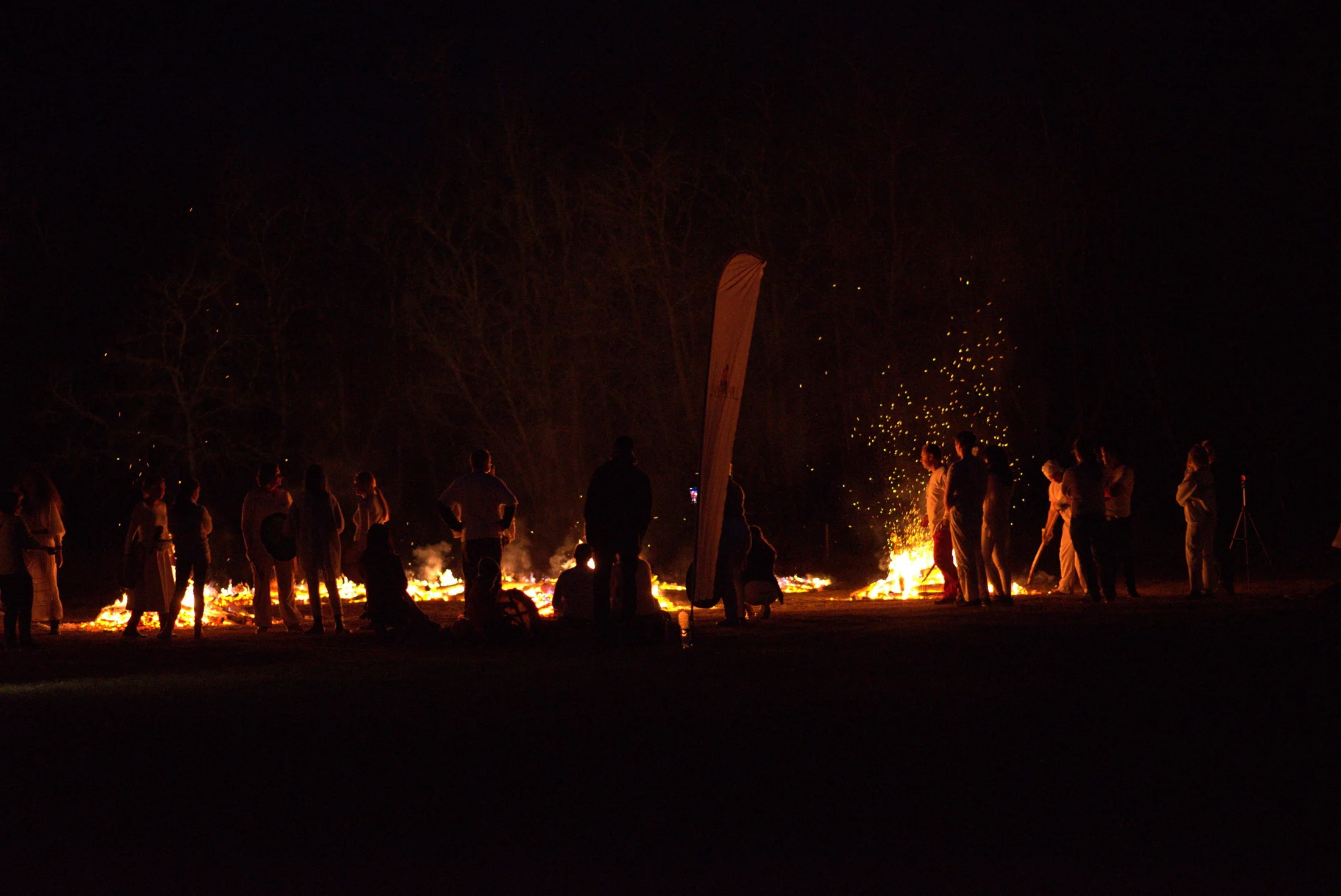 Participants gathered around the firewalking area